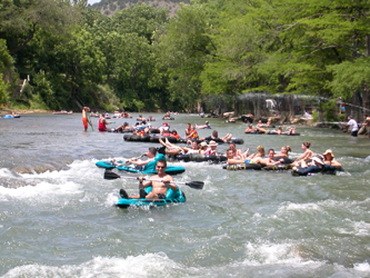 Fun Rapids and lots of Tubers on a very scenic and beautiful Guadalupe River make for a great day of fun under the sun! Tube with the Good Guys, Tube Haus.com